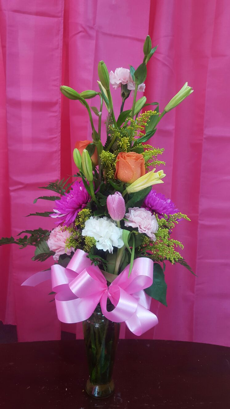 Mix flowers in thin vase Iris florist
