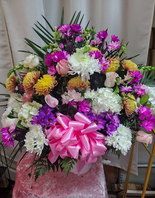 Multi shades of pink funeral basket Iris florist